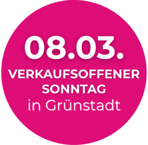 Rosa Kreis mit weißem Text: "08.03. Verkaufsoffener Sonntag in Grünstadt".